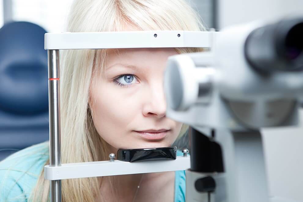 Woman having eye examed