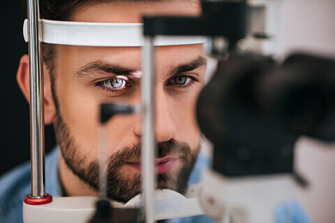 Young man getting eye exam